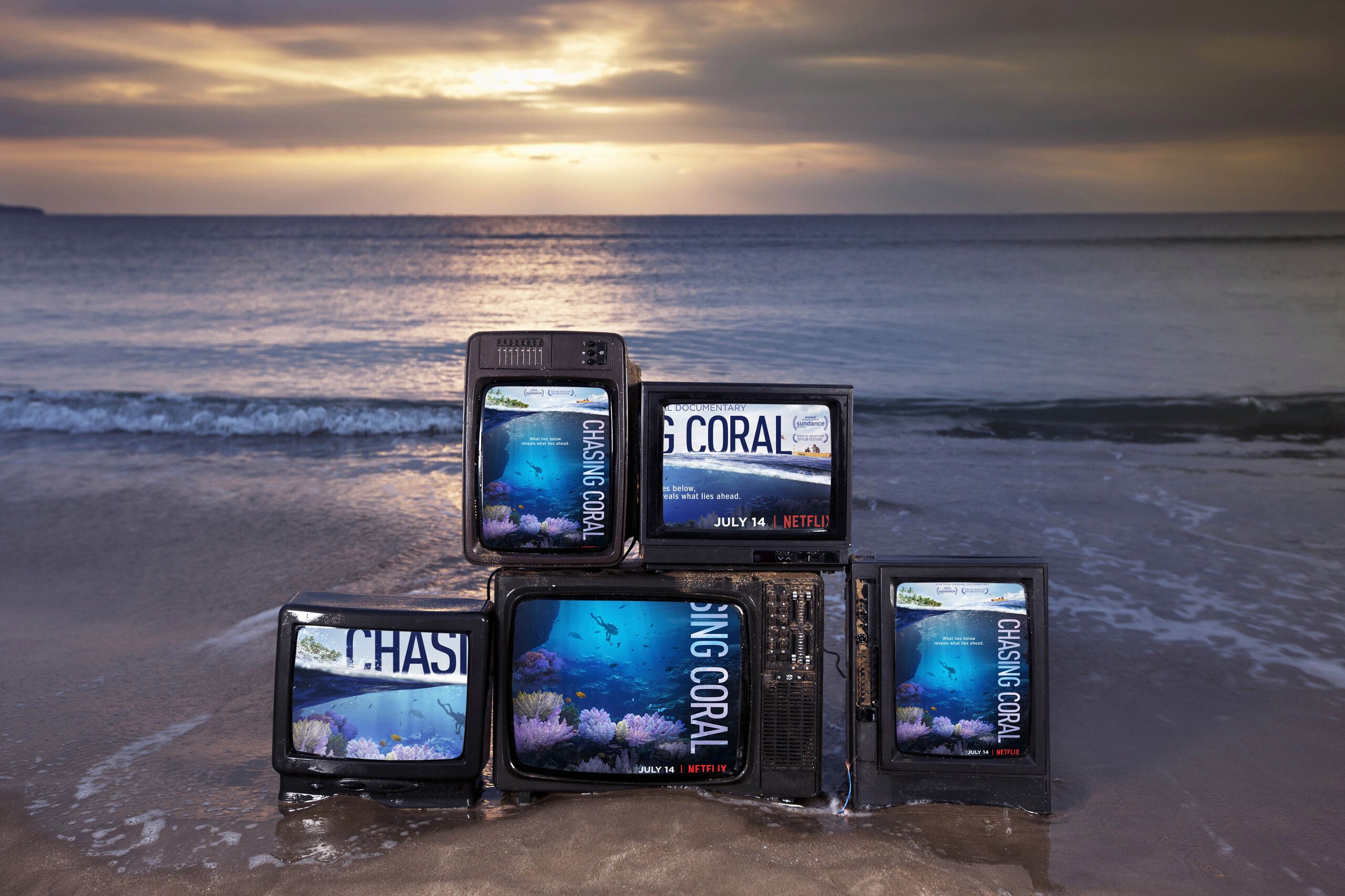 Chasing Coral Netflix production — screens arrayed on the beach